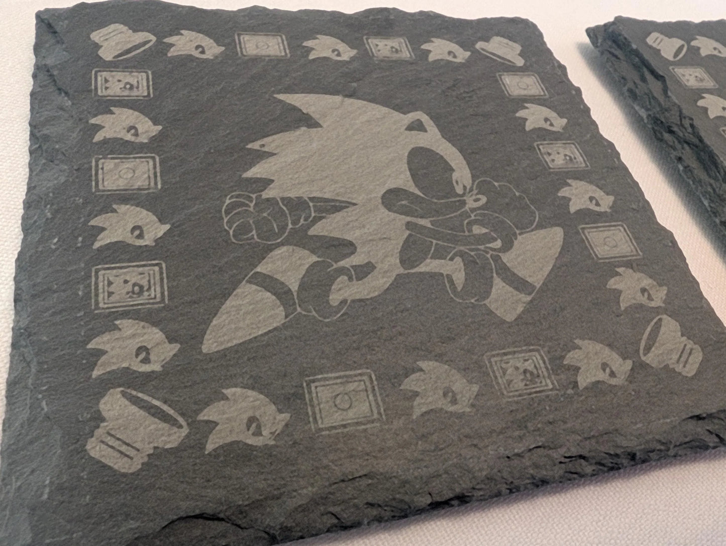 Custom engraved slate coaster featuring video game character and icons