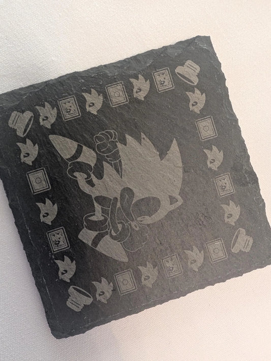 Laser engraved slate coaster with cartoon character design and geometric border