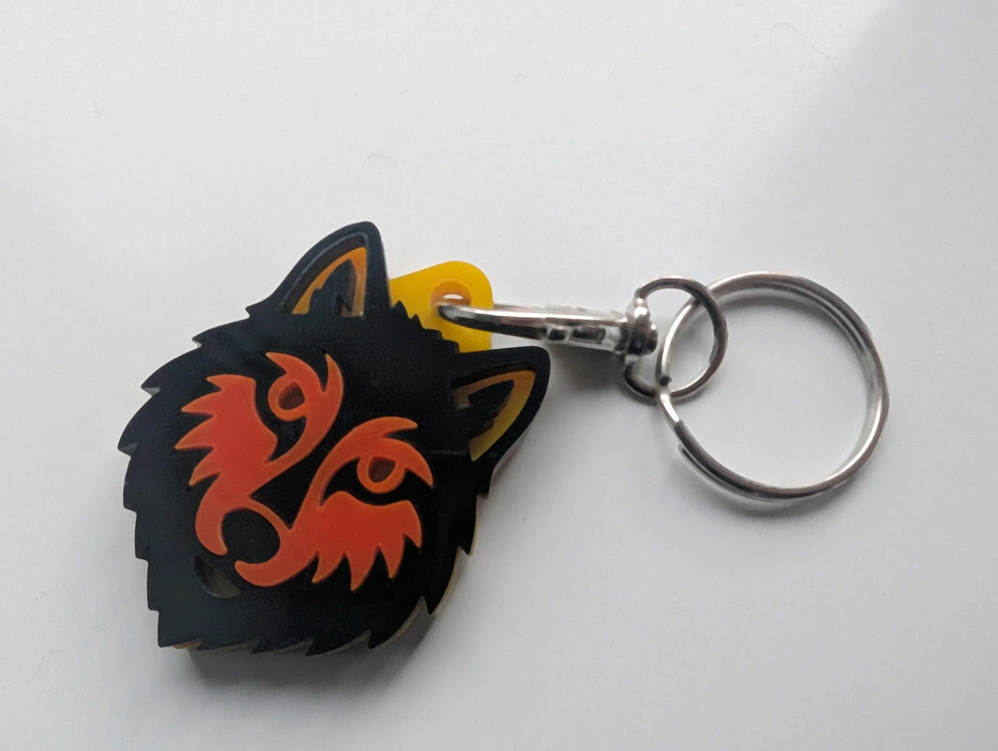 Acrylic wolf head keychain with tribal design on metal key ring, custom handmade style