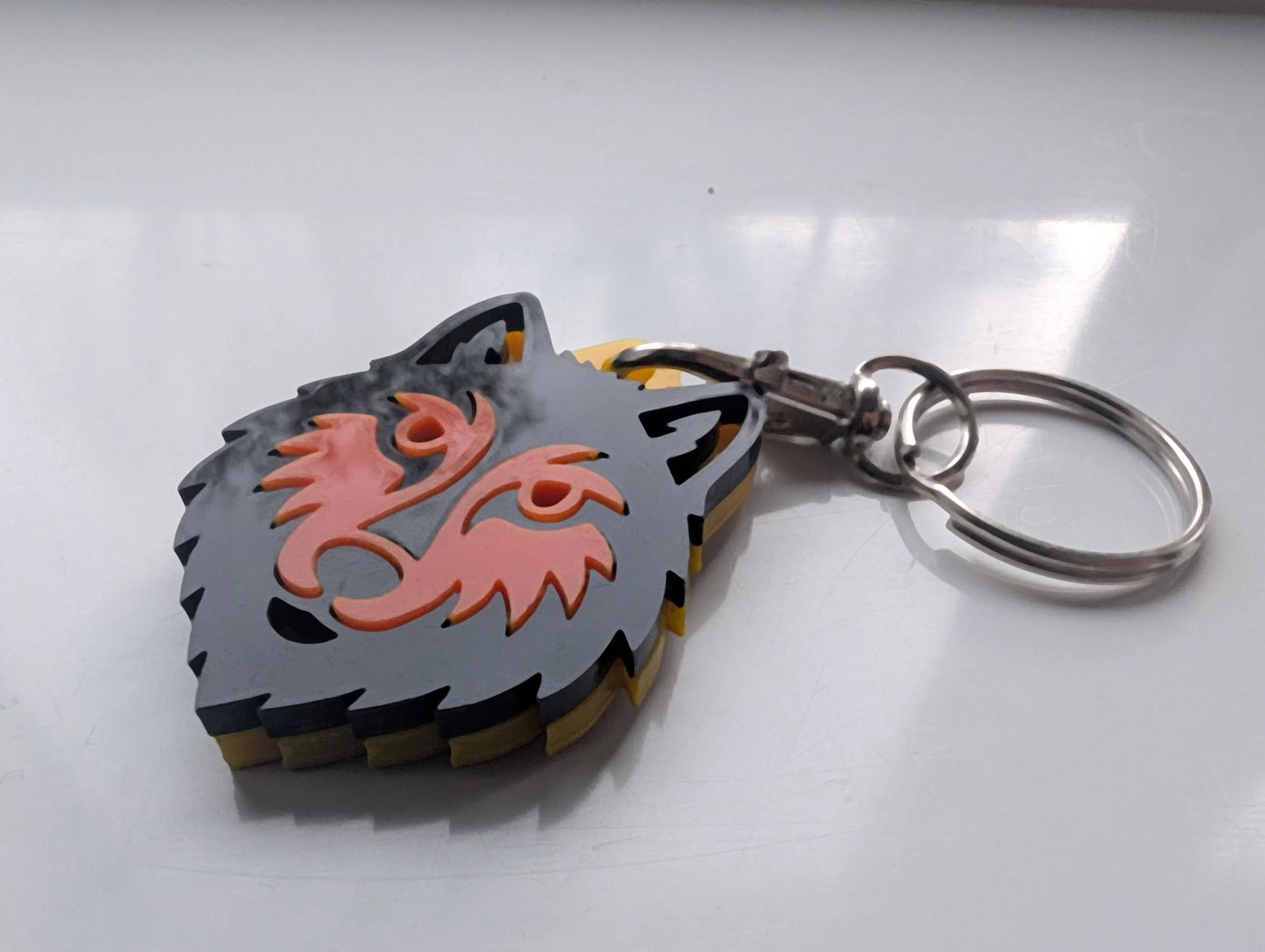 Custom acrylic wolf head keychain with layered design on silver key ring