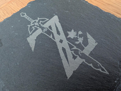 Custom engraved slate coaster with intricate sword and floral design