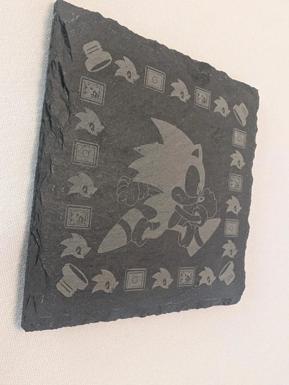 Laser-engraved slate plaque featuring a running cartoon hedgehog and gaming icons